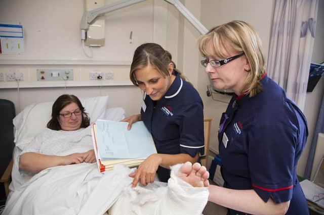 Nurses at Chesterfield Royal Hospital checking on the progress of a recovering patient in 2016.