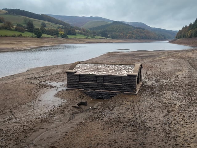 An aerial view of the of the pump house which provided water to Derwent Village, flooded in the 1940s to provide drinking water for the East Midlands and Sheffield, exposed due to the low water level at Ladybower Reservoir and drought conditions. (Photo by Christopher Furlong/Getty Images)