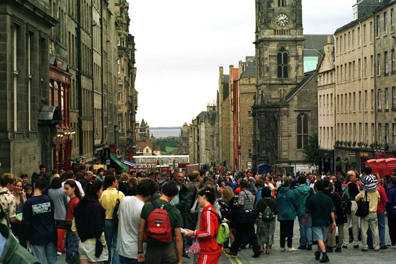 Crowds in the High Street watching street performers during the 1996 Edinburgh Festival.