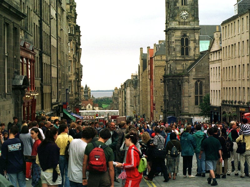 Crowds in the High Street watching street performers during the 1996 Edinburgh Festival.