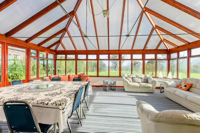 Marvel at this huge conservatory, which is almost big enough to host events in its own right! Bright and sunny, it boasts timber, double-glazed windows and French doors leading out to the garden.