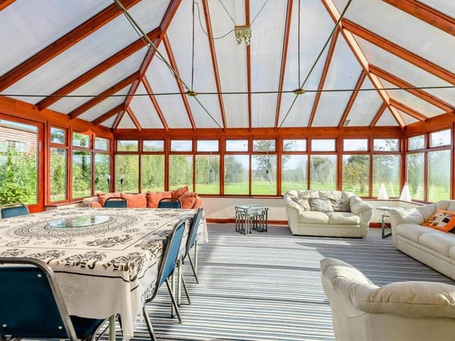 Marvel at this huge conservatory, which is almost big enough to host events in its own right! Bright and sunny, it boasts timber, double-glazed windows and French doors leading out to the garden.