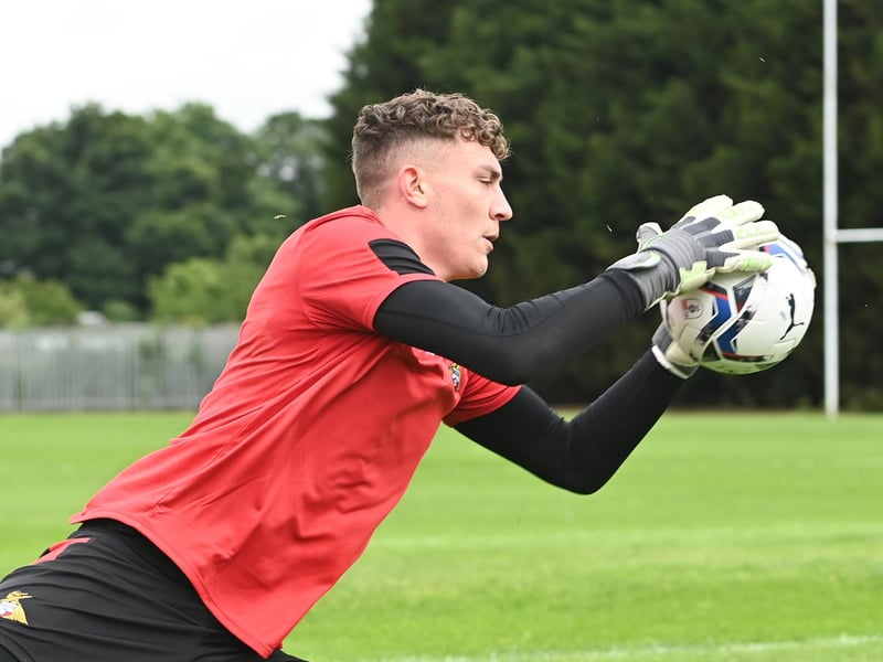 Goalkeeper Louis Jones does some handling work