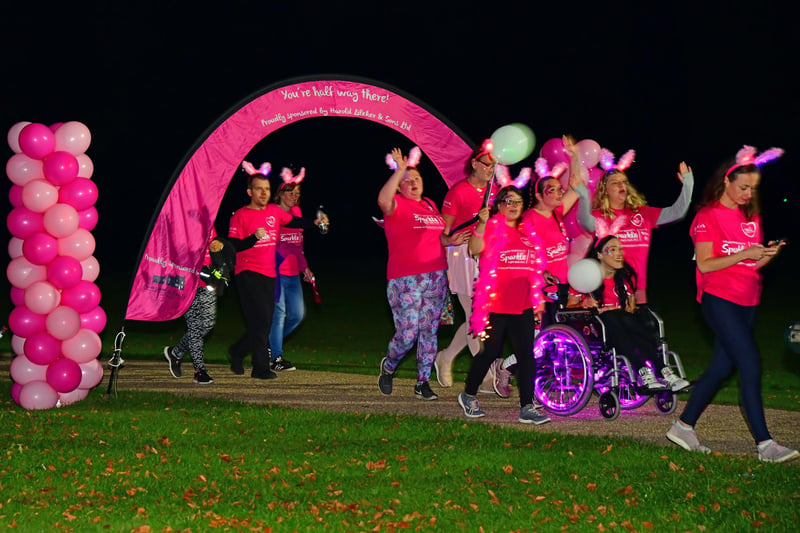 Participants in the Sparkle Walk reach the halfway stage at Eastwood Park, Hasland.