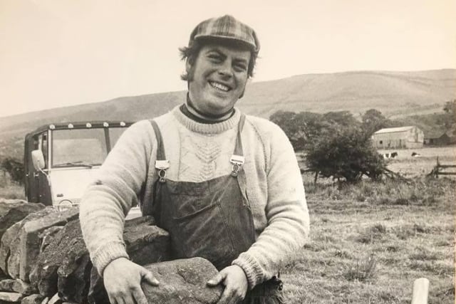 Bill Randles a National Trust warden pictured doing repairs to a dry stone wall in July 1974