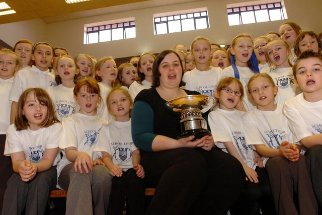 Choir mistress Caoimhe ni Chomhrai is pictured with the Castletown Primary School choir which won the City Sings competition in 2009. Does this bring back lovely memories?