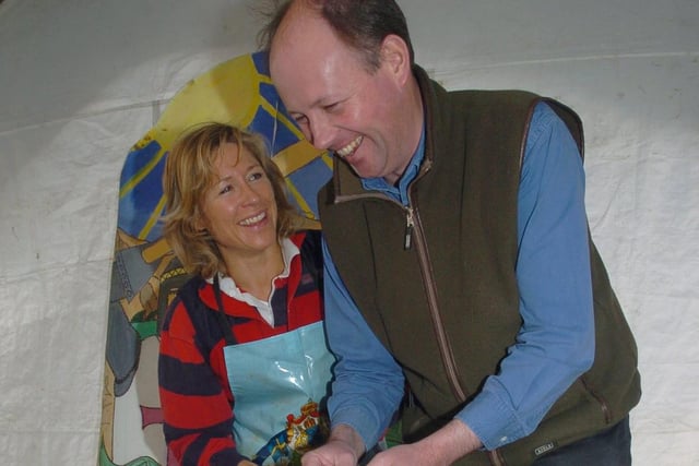 Sir Richard FitzHerbert  at Tissington Hall, Derbyshire, where he is seen lending a hand with  one of the Well Dressing displays with him isLouise Kalling-Smith in 2006