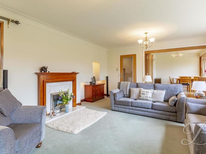Next to the dining area is this warm and homely living room, with a feature fireplace as the main focal point. Leading from here is a versatile snug, which is an ideal spot to relax.