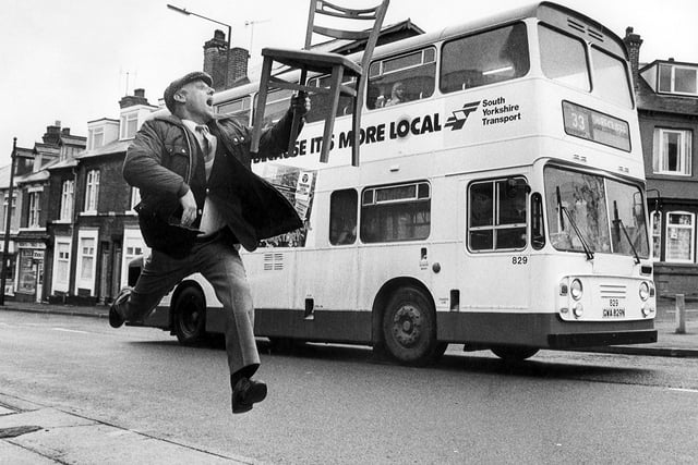 Terry Funnell of Funnell's second hand furniture store pictured running along London Road, Sheffield.  Picture by Dennis Lound