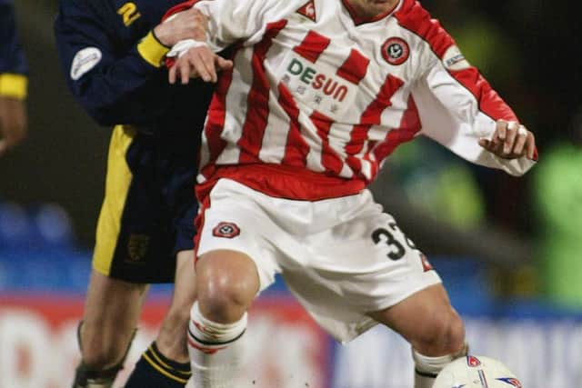 Dean Windass of Sheffield United shields the ball from Trond Andersen of Wimbledon (Photo by Ian Walton/Getty Images)