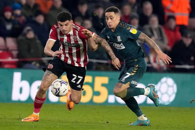 Morgan Gibbs-White of Sheffield United (L) challenges Marcus Tavernier of Middlesbrough: Andrew Yates / Sportimage