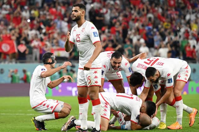 Sheffield United target Anis Ben Slimane celebrates after Wahbi Khazri of Tunisia (hidden) scored their side's goal during the FIFA World Cup Qatar 2022 Group D match between Tunisia and France at Education City Stadium: Clive Mason/Getty Images