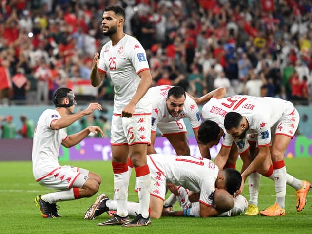 Sheffield United target Anis Ben Slimane celebrates after Wahbi Khazri of Tunisia (hidden) scored their side's goal during the FIFA World Cup Qatar 2022 Group D match between Tunisia and France at Education City Stadium: Clive Mason/Getty Images
