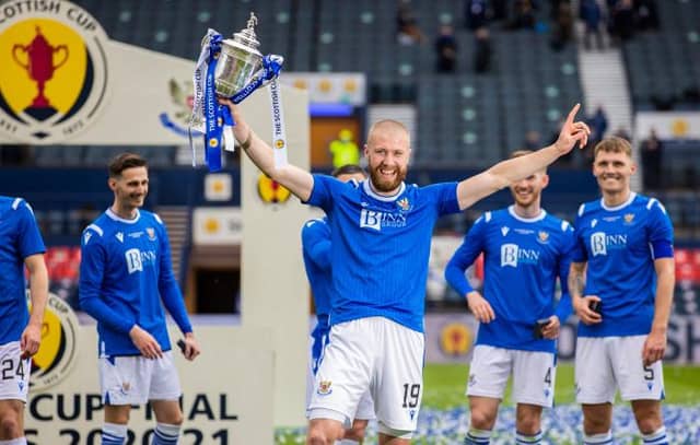 St Johnstone’s Shaun Rooney lifts the Scottish Cup trophy after scoring the winner at Hampden. (Photo by Craig Williamson / SNS Group)