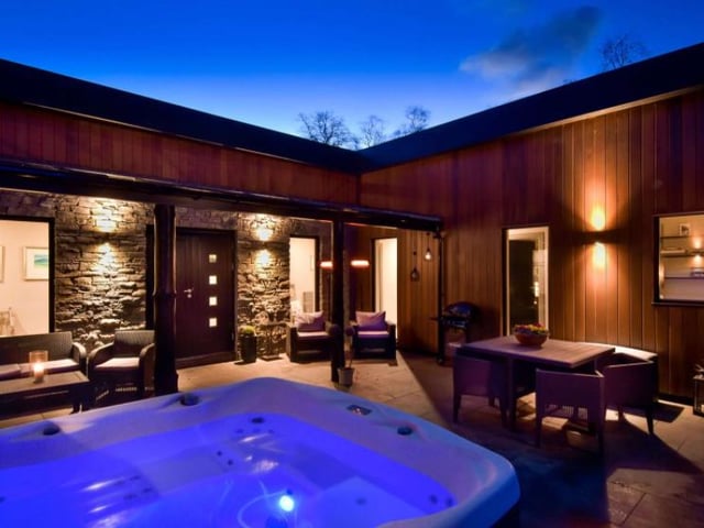 The private courtyard is another beautiful feature of the home, with a glass canopy which covers a barbeque area and a hot tub which can be enjoyed in all weathers