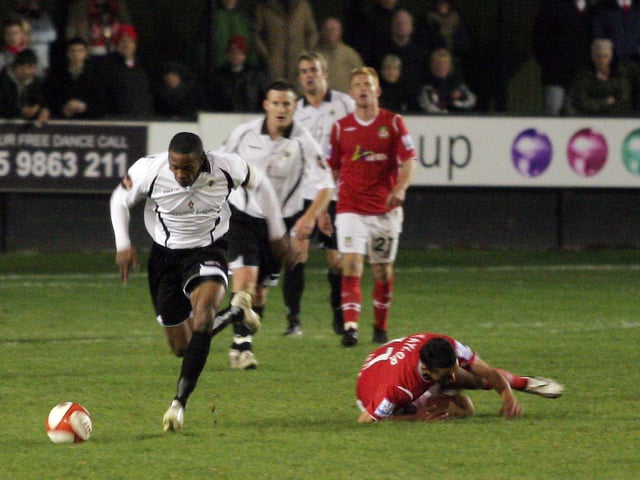 Anton Foster leaves a Wrexham opponent on the floor.