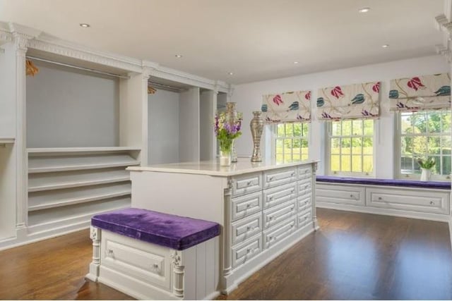 The master bedroom also has a separate dressing room, including fitted storage, shelving and dressing table.