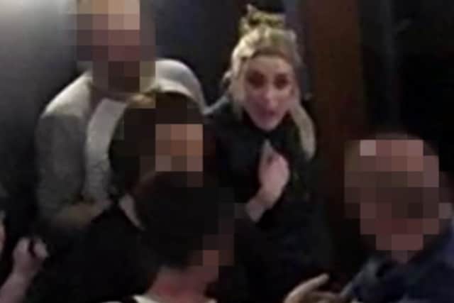 Police investigating a dog attack in a Sheffield pub have today issued CCTV pictures of a woman they want to identify.