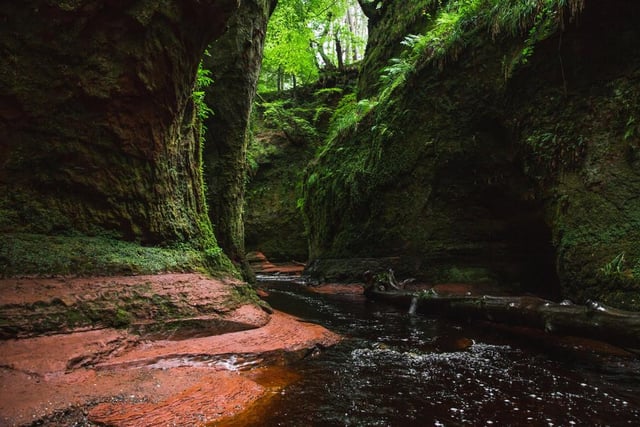 Located in Stirling, the Devil’s Pulpit is a mushroom-shaped rock surrounded by crimson-coloured waters. The surrounding moss-covered rocks and red coloured stream, caused by underlying sandstone, are bursting with colour, especially when autumnal sunlight hits (Photo: Shutterstock)