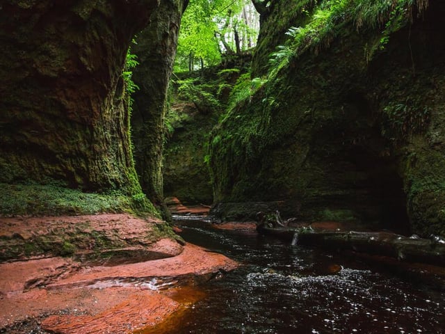 Located in Stirling, the Devil’s Pulpit is a mushroom-shaped rock surrounded by crimson-coloured waters. The surrounding moss-covered rocks and red coloured stream, caused by underlying sandstone, are bursting with colour, especially when autumnal sunlight hits (Photo: Shutterstock)