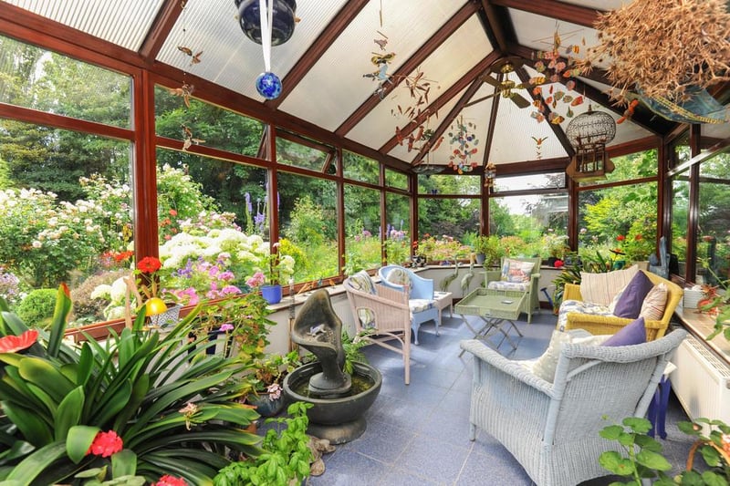 The conservatory boasts panoramic views of the garden.