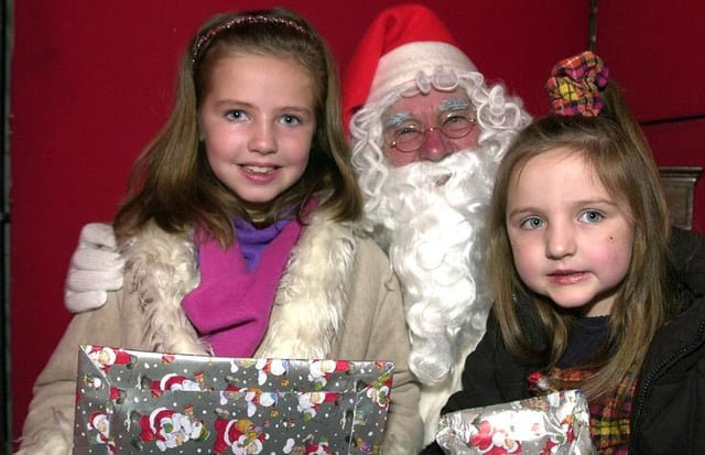 A Christmas fayre was held at the Mansion House in 2002. Sisters Bethan and Jessica McFarlane met Santa at the event.
