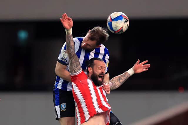 Sheffield Wednesday's Tom Lees and Stoke City's Steven Fletcher battle it out. (Mike Egerton/PA Wire)