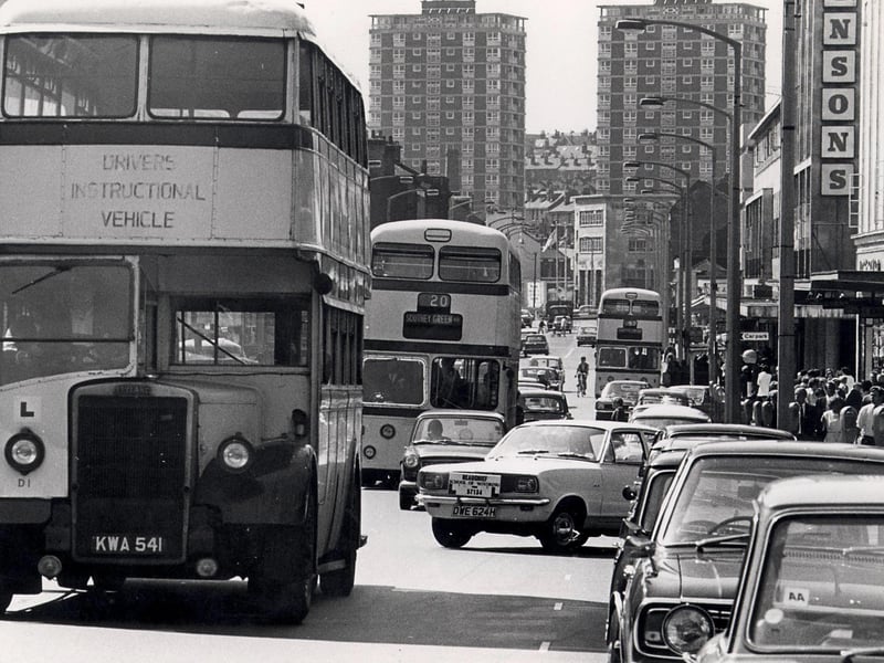 A busy traffic scene on The Moor, with Atkinsons store on the right