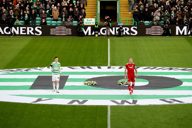 Celtic captain Callum McGregor (left) and Aberdeen skipper Brown lay wreathes in tribute to Lisbon Lion Bertie Auld during a Cinch Premiership match at Celtic Park, on November 28, 2021.