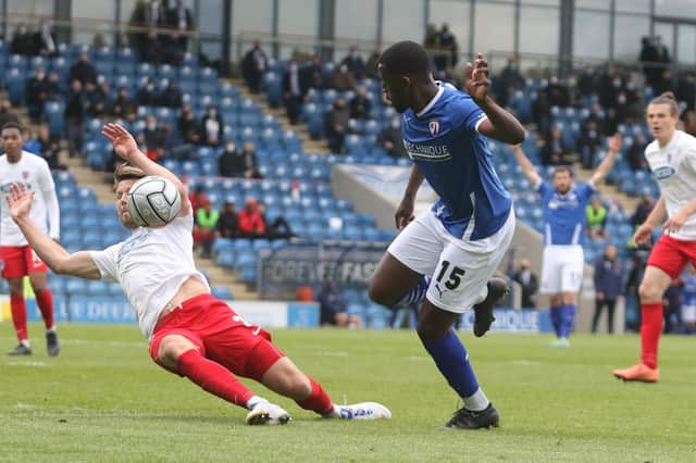 Chesterfield beat Dagenham and Redbridge 2-1 at the Technique Stadium to keep their play-off hopes alive.