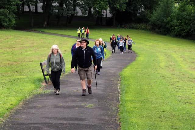 Members of Step Out Sheffield climbing the hill in Meersbrook Park in 2017