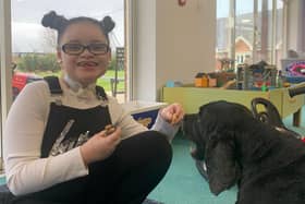 Sienna with George, the resident lab, at Bluebell Wood Children's Hospice