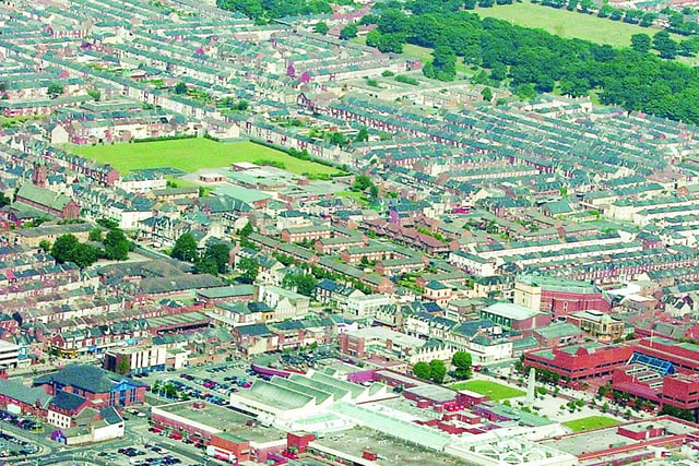 A 2005 view of the houses near Middleton Grange Shopping Centre. How many do you recognise?