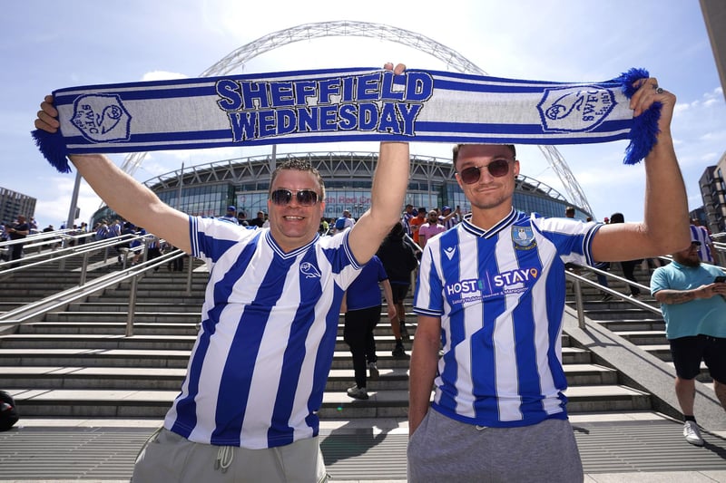 Sheffield Wednesday fans pose for photographs outside the Sky Bet League One play-off final at Wembley Stadium, London.  Nick Potts/PA Wire.