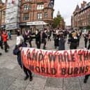 An Extinction Rebellion flash mob like the one being held on The Moor in Sheffield city centre to highlight the need for action ahead of the COP26 climate change summit