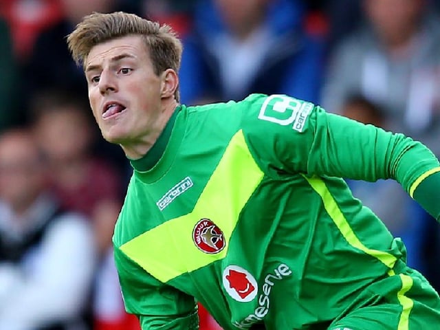 The keeper hasn't changed too much in five years. He still can't put his tongue away!