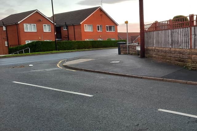The now empty space at the top of the hill of Littlewood Road where the grit bin was removed.