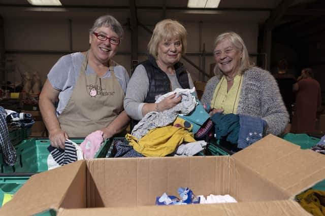 Maggie Hanson, Gill Manifold and Joy Tanner at Baby Basics UK pack baby equipment for Afghan refugee families across the UK.  Picture Scott Merrylees