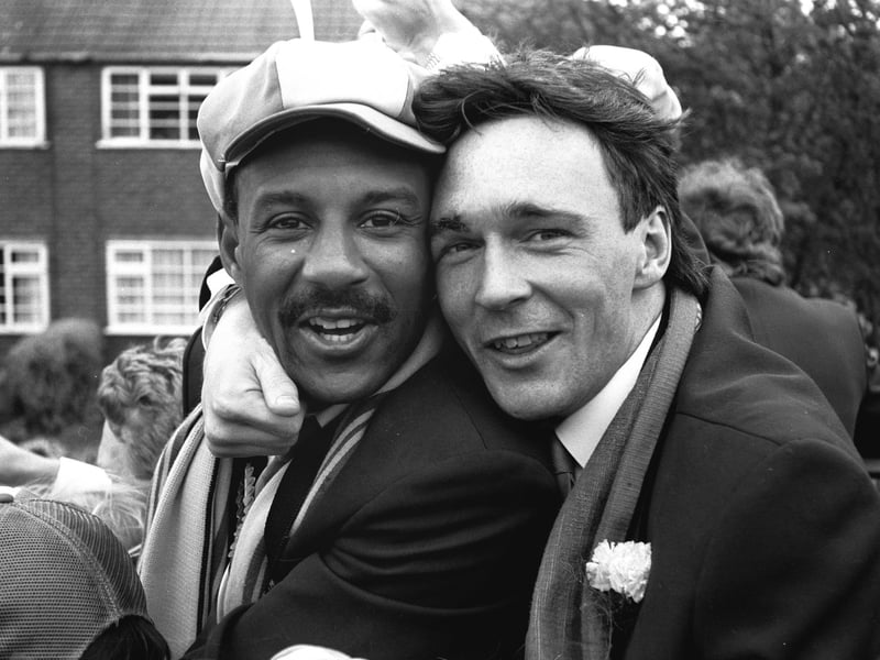 Keith Cassells and Tony Kenworthy celebrating their win on open top bus parade through Mansfield.