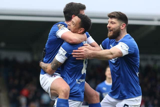 Nathan Tyson is mobbed by his teammates after scoring a second-half hat-trick for Chesterfield against Ebbsfleet United.
