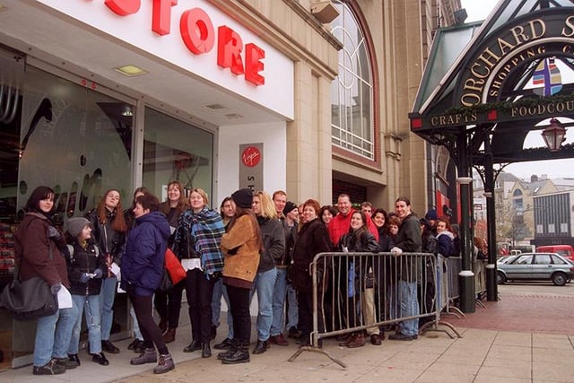 Def Leppard fans queue outside the Virgin Megastore in Orchard Square for free tickets to see their heroes perform there, November 1996