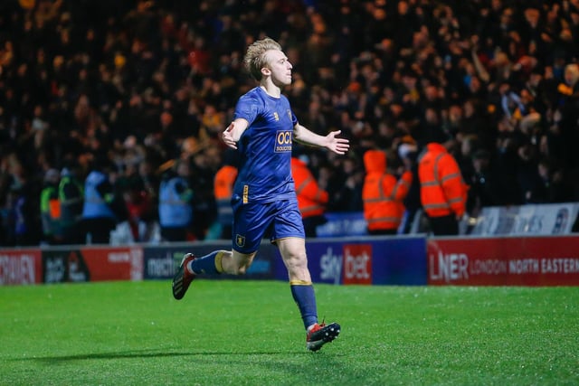 Mansfield Town midfielder George Lapslie celebrates his first of two goals scored against Doncaster Rovers.