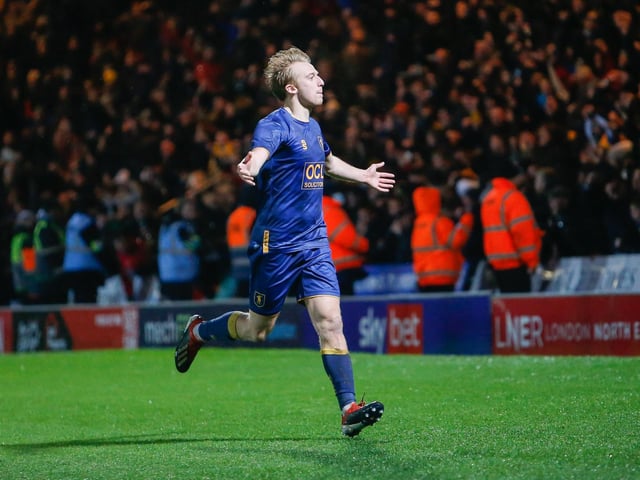 Mansfield Town midfielder George Lapslie celebrates his first of two goals scored against Doncaster Rovers.