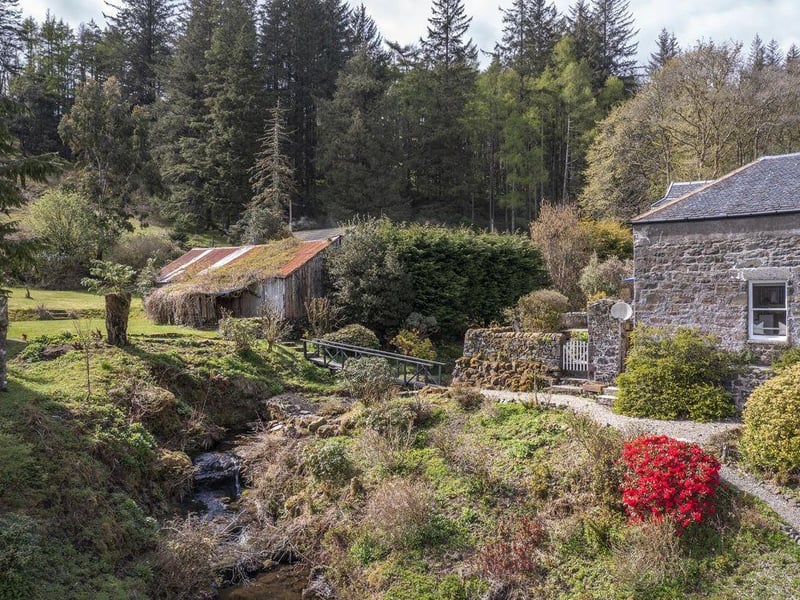 Gardens with bridge over burn.
