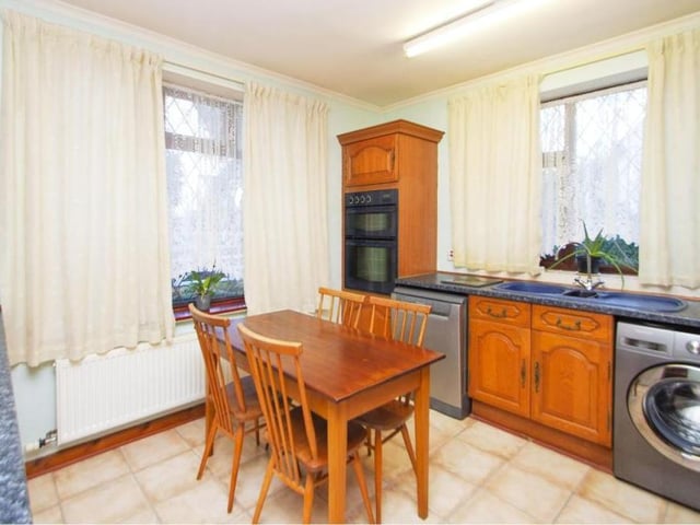 The kitchen has plenty of room for a breakfast table, not to mention an assortment of wall and base units with worktop over, and an inset sink and drainer. There is also a radiator and double-glazed windows to the side and front of the bungalow.