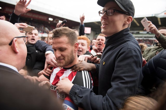 Billy Sharp celebrates with fans after winning promotion to the Sky Bet Championship in April 2017.