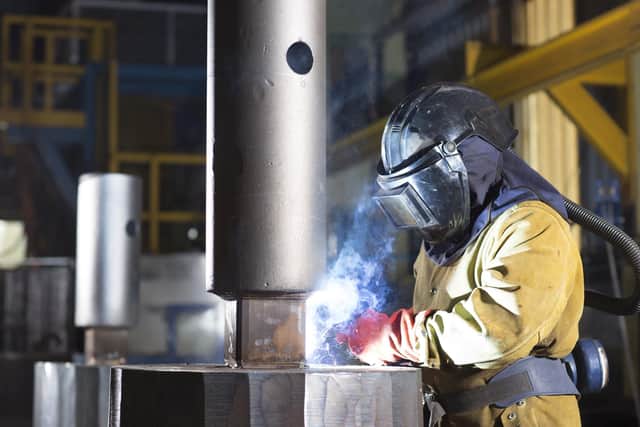 A worker preparing an ingot to go into the VAR furnace (Vacuum Arc Remelting) at Liberty Speciality Steels Stocksbridge.