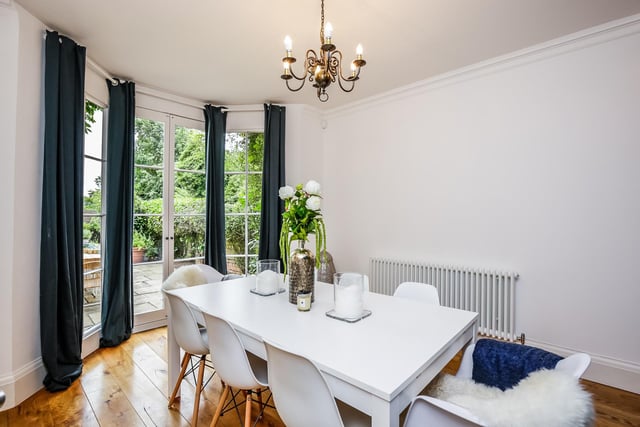 A full height bay window with French doors opens to the rear terrace which gives the room a "light and airy feel".