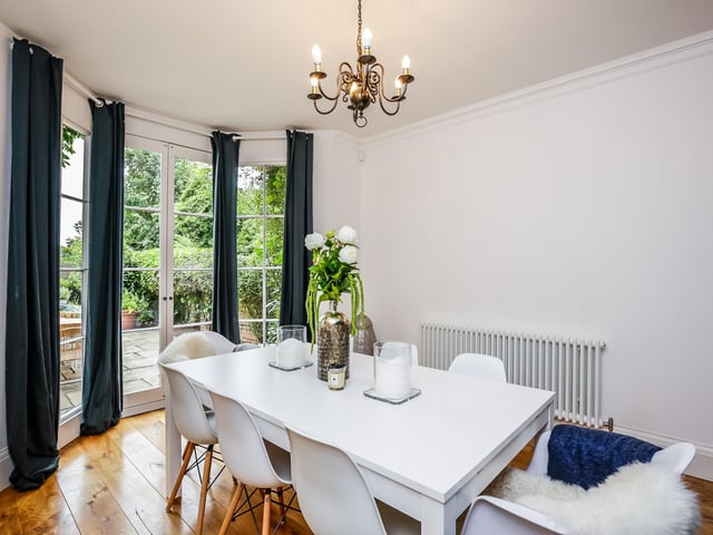 A full height bay window with French doors opens to the rear terrace which gives the room a "light and airy feel".