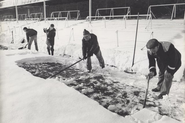 Staff and supporters of Chesterfield FC started the task of clearing the snow at their Saltergate pitch in the hope of a start to the local Boxing Day derby match of Chesterfield vs Doncaster in 1981